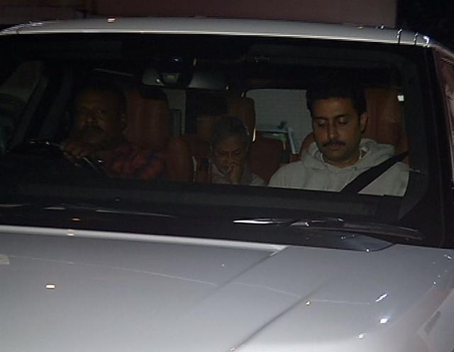 Jaya Bachchan and Abhishek accompany Amitabh Bachchan on their way home.