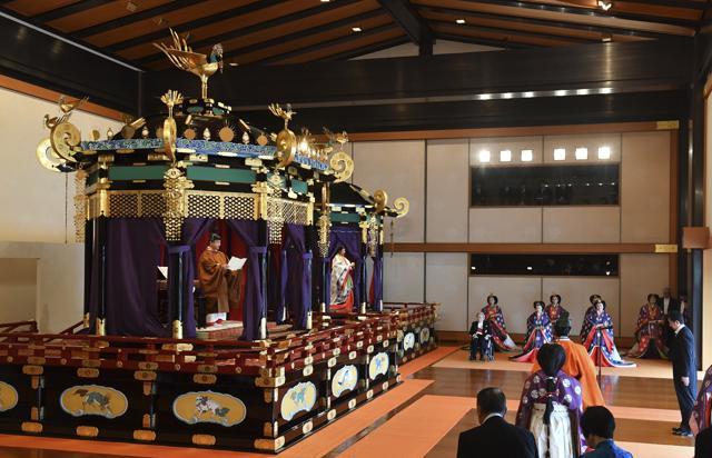 Japan's Emperor Naruhito, left, delivers his speech as Empress Masako, second from left, Prime Minister Shinzo Abe, right, and other officials attend the enthronement ceremony where the emperor officially proclaims his ascension to the Chrysanthemum Throne at the Imperial Palace in Tokyo Tuesday, Oct. 22, 2019. (Kazuhiro Nogi/Pool Photo via AP) (AP) Japan's Emperor Naruhito, left, delivers his speech as Empress Masako, second from left, Prime Minister Shinzo Abe, right, and other officials attend the enthronement ceremony where the emperor officially proclaims his ascension to the Chrysanthemum Throne at the Imperial Palace in Tokyo Tuesday, Oct. 22, 2019. (Kazuhiro Nogi/Pool Photo via AP) (AP)