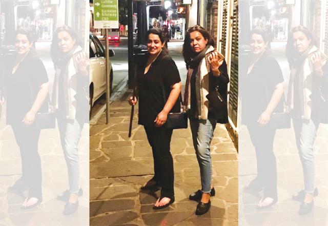 The author (left) armed with a stick to brave the real zombies walking the streets (Aarti Sethi) The author (left) armed with a stick to brave the real zombies walking the streets (Aarti Sethi)