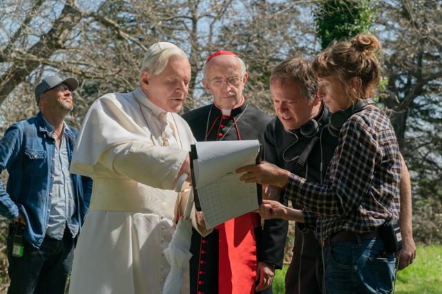Actors Anthony Hopkins (second from right), Jonathan Pryce (middle) and filmmaker Fernando Meirelles while shooting for the film Actors Anthony Hopkins (second from right), Jonathan Pryce (middle) and filmmaker Fernando Meirelles while shooting for the film