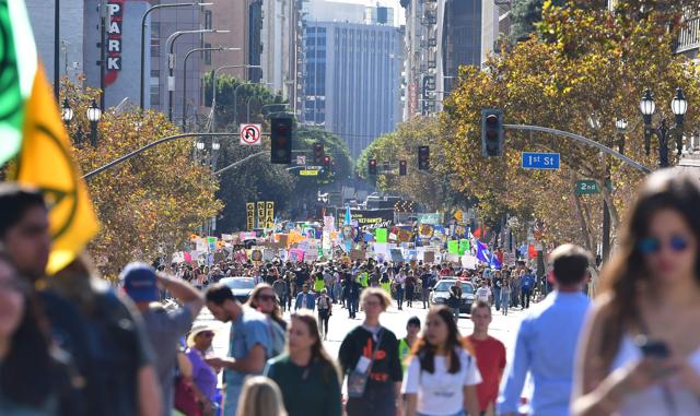 Activists march through downtown Los Angeles in a climate change rally where teenage Swedish activist Greta Thunberg addressed the crowd while attending in Los Angeles. (AFP) Activists march through downtown Los Angeles in a climate change rally where teenage Swedish activist Greta Thunberg addressed the crowd while attending in Los Angeles. (AFP)