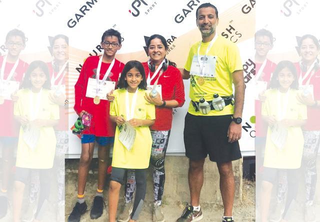 The author (second from left) with her brother Arhaan, 12, and her corporate lawyer parents Madhurima Mukherjee and Gautam Saha The author (second from left) with her brother Arhaan, 12, and her corporate lawyer parents Madhurima Mukherjee and Gautam Saha