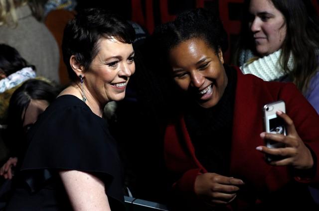 Actor Olivia Colman poses for a selfie with a fan during the world premiere of the third season of The Crown. (REUTERS) Actor Olivia Colman poses for a selfie with a fan during the world premiere of the third season of The Crown. (REUTERS)