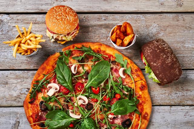 Fast foods like pizzas and burger are doing more harm to us (Shutterstock) Fast foods like pizzas and burger are doing more harm to us (Shutterstock)