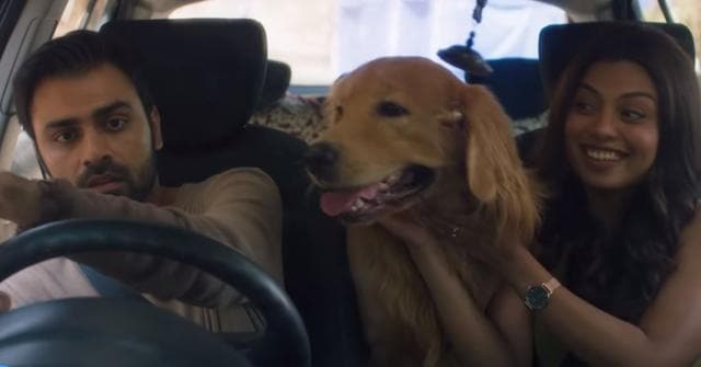 Jitendra Kumar and Akanksha Thakur with the abandoned dog in a still from Cheesecake.