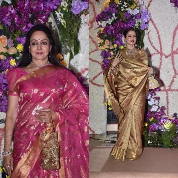 Hema Malini wore a gorgeous pink sari while Rekha donned her golden look for the bash. (Varinder Chawla) Hema Malini wore a gorgeous pink sari while Rekha donned her golden look for the bash. (Varinder Chawla)