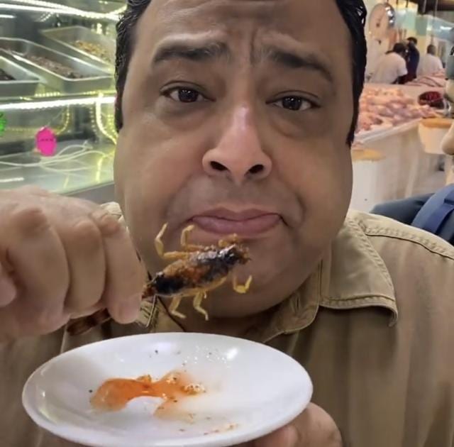 Manish Mehrotra eating his Scorpion chaat. Manish Mehrotra eating his Scorpion chaat.