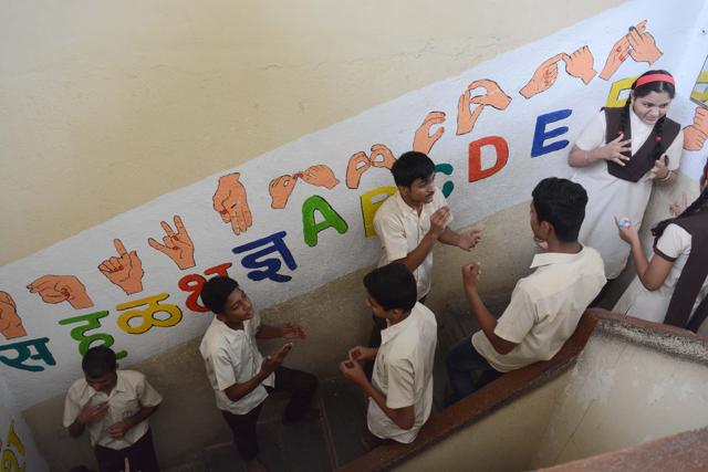 Students of Ranganathan college during a class break on Thursday. (Shankar Narayan/HT PHOTO)