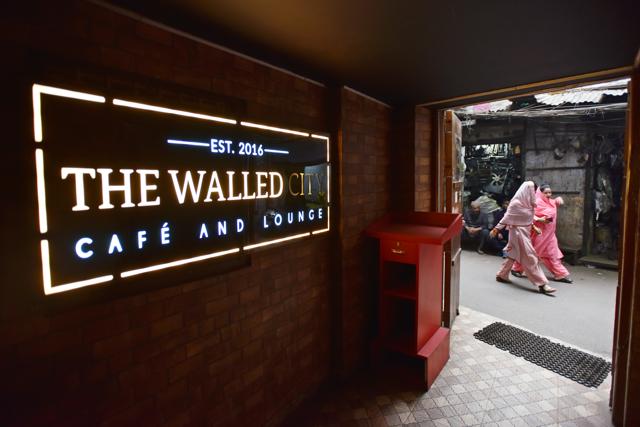 The entrance to The Walled City Cafe, situated in a 200-year-old haveli in Old Delhi. The principle of adaptive reuse is that when you restore a crumbling building, turn the insides into something completely different and make it relevant again, you shine a light on the space, the area, and its history. (Sanchit Khanna / HT Photo) The entrance to The Walled City Cafe, situated in a 200-year-old haveli in Old Delhi. The principle of adaptive reuse is that when you restore a crumbling building, turn the insides into something completely different and make it relevant again, you shine a light on the space, the area, and its history. (Sanchit Khanna / HT Photo)