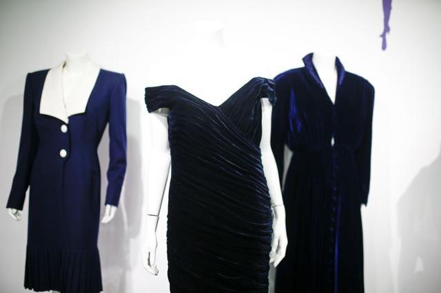 Britain's Princess Diana's Victor Edelstein midnight-blue velvet evening gown (estimated at £250,000 - £350,000), which was worn by the princess when she danced with actor John Travolta at the White House in 1985. Also pictured is her Katherine Cusack evening gown (estimated at £20,000 -£30,000) and her Catherine Walker dress (estimated £4,000 - £6,000), displayed at Kerry Taylor auctions in London, Britain December 8, 2019. REUTERS/Henry Nicholls (REUTERS) Britain's Princess Diana's Victor Edelstein midnight-blue velvet evening gown (estimated at £250,000 - £350,000), which was worn by the princess when she danced with actor John Travolta at the White House in 1985. Also pictured is her Katherine Cusack evening gown (estimated at £20,000 -£30,000) and her Catherine Walker dress (estimated £4,000 - £6,000), displayed at Kerry Taylor auctions in London, Britain December 8, 2019. REUTERS/Henry Nicholls (REUTERS)