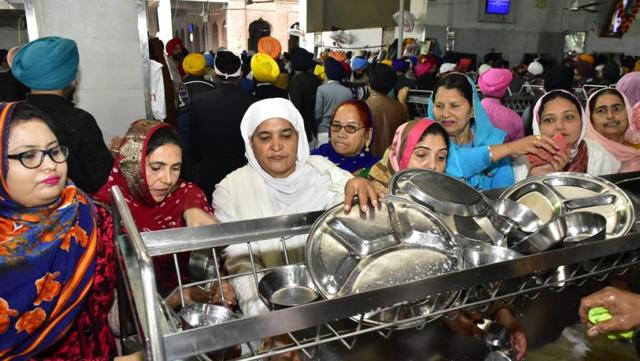 Former SGPC chief Jagir Kaur (in white) cleaning utensils at the langar hall (community kitchen) of Golden Temple on Thursday morning. (Sameer Sehgal/HT) Former SGPC chief Jagir Kaur (in white) cleaning utensils at the langar hall (community kitchen) of Golden Temple on Thursday morning. (Sameer Sehgal/HT)