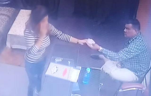 CCTV footage submitted by the complainant shows the home guard volunteer, Jashan Pal, collecting money from the salon in Sector 5, Mansa Devi Complex, and (below) manhandling the salon’s female manager. CCTV footage submitted by the complainant shows the home guard volunteer, Jashan Pal, collecting money from the salon in Sector 5, Mansa Devi Complex, and (below) manhandling the salon’s female manager.