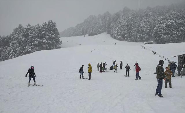 Tourists visit Auli following fresh snowfall in Chamoli district of Uttarakhand, on Thursday. (PTI Photo) Tourists visit Auli following fresh snowfall in Chamoli district of Uttarakhand, on Thursday. (PTI Photo)
