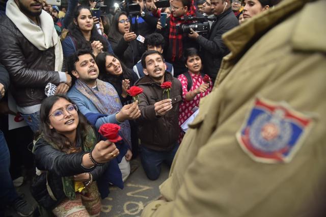 Protestors giving rose to a policeman. Protestors giving rose to a policeman.
