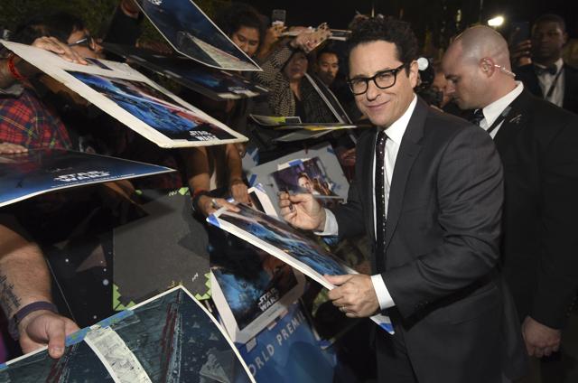 J.J. Abrams signs autographs as he arrives at the world premiere of Star Wars: The Rise of Skywalker. (Chris Pizzello/Invision/AP) J.J. Abrams signs autographs as he arrives at the world premiere of Star Wars: The Rise of Skywalker. (Chris Pizzello/Invision/AP)