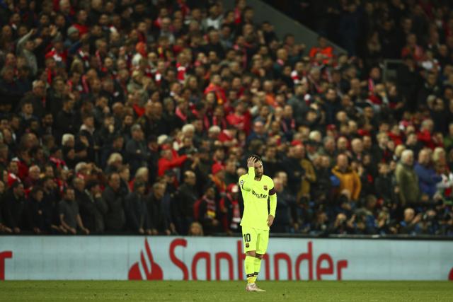 Barcelona's Lionel Messi reacts as Liverpool's Divock Origi celebrates scoring his side's 4th goal. (AP) Barcelona's Lionel Messi reacts as Liverpool's Divock Origi celebrates scoring his side's 4th goal. (AP)