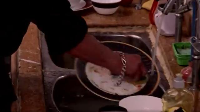 Salman Khan cleans utensils. Salman Khan cleans utensils.