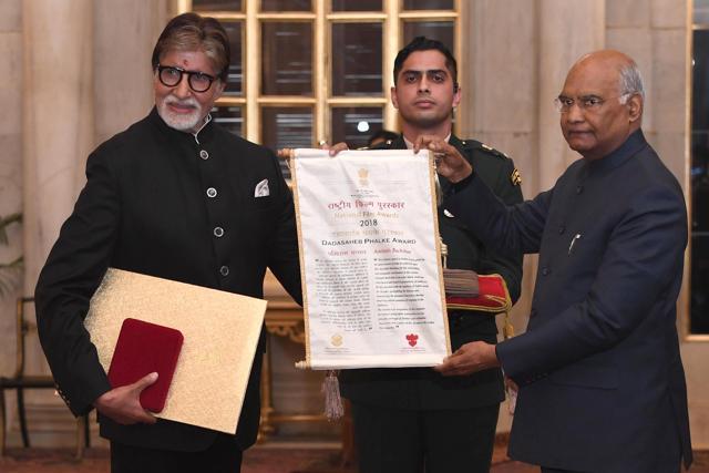 President Ram Nath Kovind presents the Dada Saheb Phalke Award for the year 2018 to Bollywood actor Amitabh Bachchan. President Ram Nath Kovind presents the Dada Saheb Phalke Award for the year 2018 to Bollywood actor Amitabh Bachchan.
