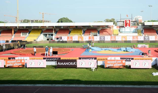 The lush green Shiv Chhatrapati Sports Complex has transformed itself into an akhada (wrestling ring) where two arenas of mud along with two arenas of mat have been set up in the middle of the stadium. (Milind Saurkar/HT Photo) The lush green Shiv Chhatrapati Sports Complex has transformed itself into an akhada (wrestling ring) where two arenas of mud along with two arenas of mat have been set up in the middle of the stadium. (Milind Saurkar/HT Photo)