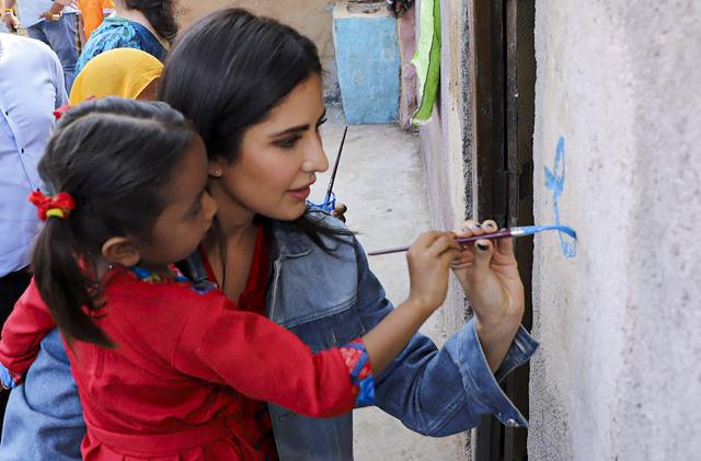 Katrina Kaif draws with girl during a visit organised by NGO Educate Girls to support girl child education, in Dhar district of Madhya Pradesh. (PTI) Katrina Kaif draws with girl during a visit organised by NGO Educate Girls to support girl child education, in Dhar district of Madhya Pradesh. (PTI)