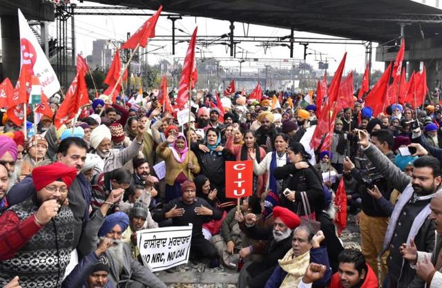 Trade union activists holding a protest on the rail tracks near Amritsar station on Wednesday. (Sameer Sehgal/HT) Trade union activists holding a protest on the rail tracks near Amritsar station on Wednesday. (Sameer Sehgal/HT)