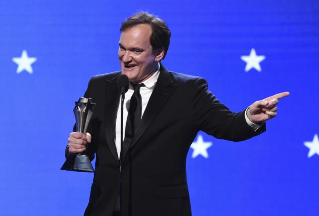 Quentin Tarantino accepts on behalf of Brad Pitt the award for best supporting actor for Once Upon a Time… in Hollywood at the 25th annual Critics' Choice Awards on Sunday. (Chris Pizzello/Invision/AP) Quentin Tarantino accepts on behalf of Brad Pitt the award for best supporting actor for Once Upon a Time… in Hollywood at the 25th annual Critics' Choice Awards on Sunday. (Chris Pizzello/Invision/AP)