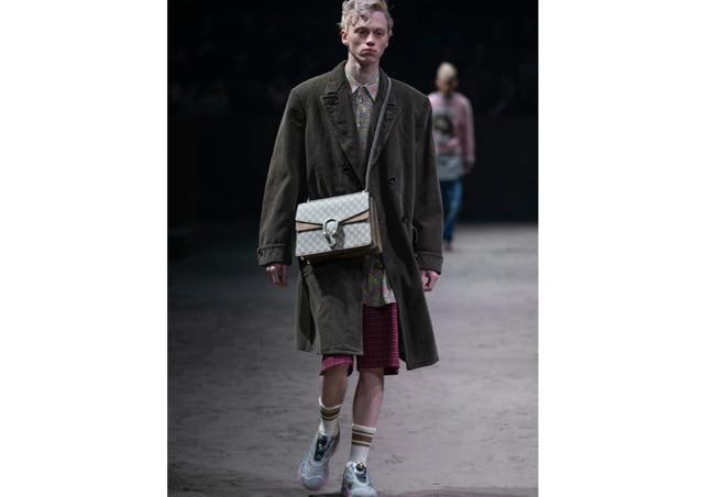 A model in a Gucci ensemble. A model in a Gucci ensemble.