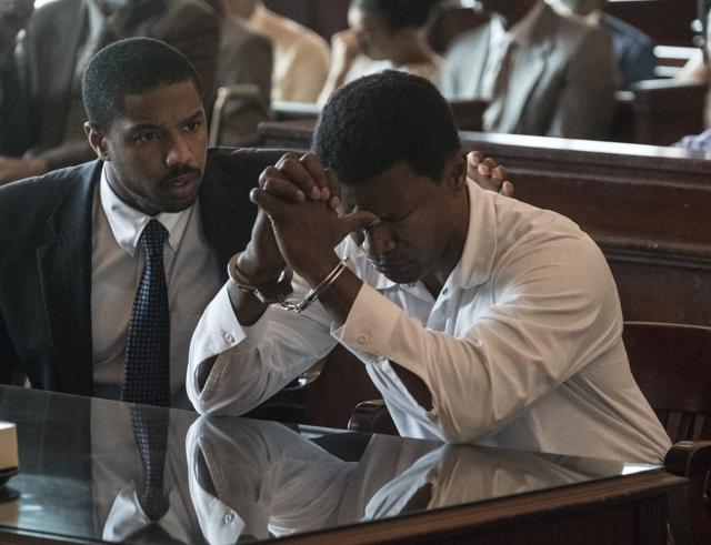 This image released by Warner Bros Pictures shows Michael B. Jordan, left, and Jamie Foxx in a scene from Just Mercy. (AP) This image released by Warner Bros Pictures shows Michael B. Jordan, left, and Jamie Foxx in a scene from Just Mercy. (AP)