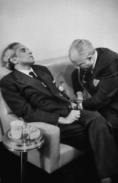 VK Krishna Menon being attended to by his doctor after he collapsed at a United Nations Security Council meeting, having delivered an eight-hour filibuster in defence of India's involvement in Kashmir on January 24, 1957. (Lisa Larsen/The LIFE Picture Collection via Getty Images) VK Krishna Menon being attended to by his doctor after he collapsed at a United Nations Security Council meeting, having delivered an eight-hour filibuster in defence of India's involvement in Kashmir on January 24, 1957. (Lisa Larsen/The LIFE Picture Collection via Getty Images)