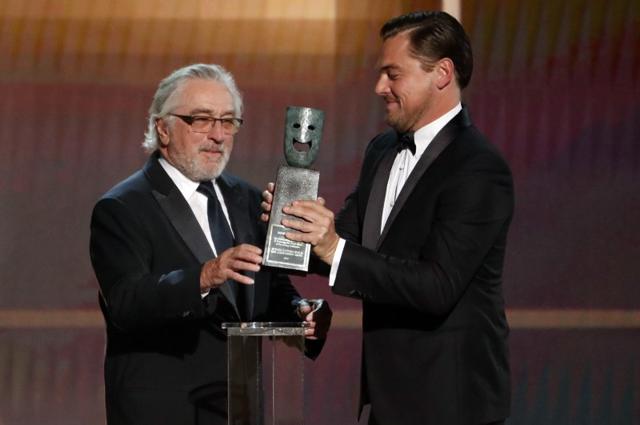 Robert De Niro accepts the Life Achievement Award from presenter Leonardo DiCaprio. Robert De Niro accepts the Life Achievement Award from presenter Leonardo DiCaprio.