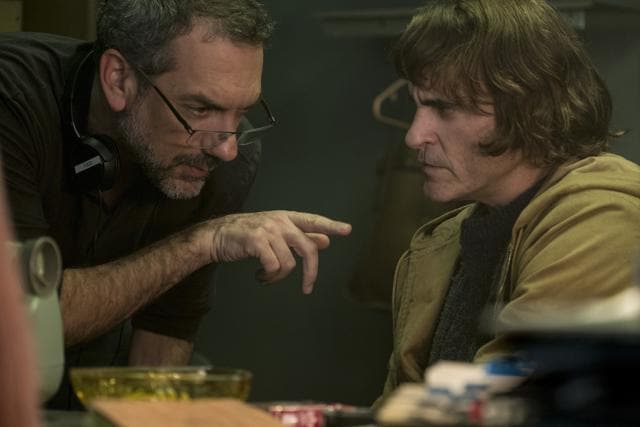 This image released by Warner Bros. Pictures shows director Todd Phillips, left, and Joaquin Phoenix on the set of Joker. (AP) This image released by Warner Bros. Pictures shows director Todd Phillips, left, and Joaquin Phoenix on the set of Joker. (AP)