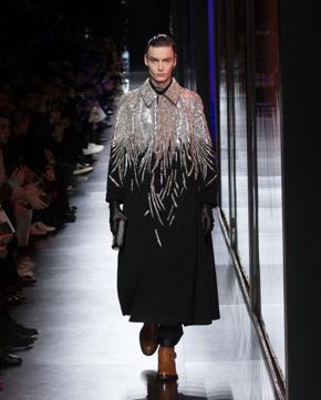 The closing look for Dior’s Men’s Fall Winter 2020 collection by Kim Jones was a crystal and sequin beaded overcoat. (Instagram/ dior) The closing look for Dior’s Men’s Fall Winter 2020 collection by Kim Jones was a crystal and sequin beaded overcoat. (Instagram/ dior)