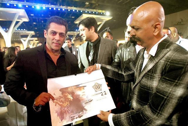 Mumbai: A copy of the Mumbai Police Calendar being presented to Bollywood superstar Salman Khan at the grand event Umang in Mumbai. (IANS) Mumbai: A copy of the Mumbai Police Calendar being presented to Bollywood superstar Salman Khan at the grand event Umang in Mumbai. (IANS)
