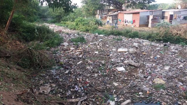 The Bairobha nallah stretch had become a dumping ground for household waste. Coupled with the trash, the stagnant water ha triggered a massive health hazard for residents. (HT/PHOTO) The Bairobha nallah stretch had become a dumping ground for household waste. Coupled with the trash, the stagnant water ha triggered a massive health hazard for residents. (HT/PHOTO)