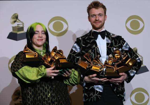 Billie Eilish and Finneas O'Connell pose backstage with her awards to include Song of the Year for Bad Guy , Best New Artist, and Album of the Year for When We All Fall Asleep, Where Do We Go?. (REUTERS) Billie Eilish and Finneas O'Connell pose backstage with her awards to include Song of the Year for Bad Guy , Best New Artist, and Album of the Year for When We All Fall Asleep, Where Do We Go?. (REUTERS)