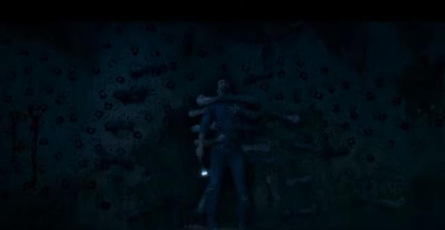 Vicky Kaushal gets pulled into the wall by many hands. Vicky Kaushal gets pulled into the wall by many hands.
