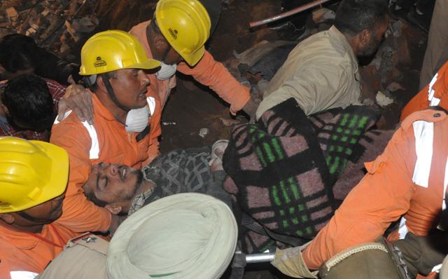 Harjit being rescued after remaining trapped under the debris for eight hours. Harjit being rescued after remaining trapped under the debris for eight hours.