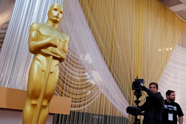 A camera crew runs through a shot movement around an Oscar statue in preparation for the 92nd Academy Awards in Los Angeles. (REUTERS) A camera crew runs through a shot movement around an Oscar statue in preparation for the 92nd Academy Awards in Los Angeles. (REUTERS)