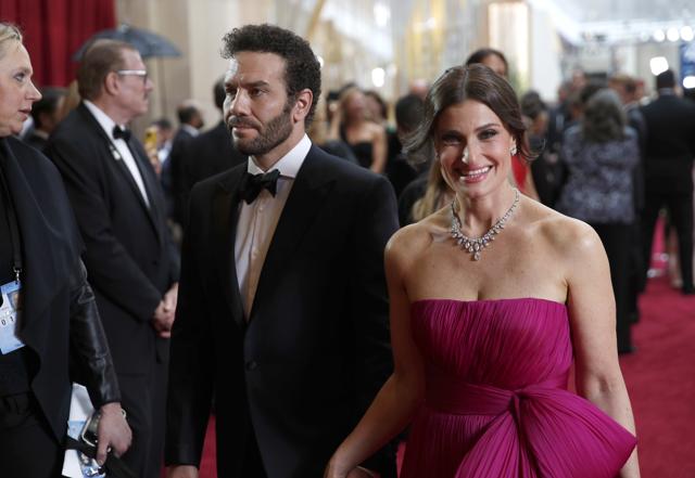 Aaron Lohr, left, and Idina Menzel arrive at the Oscars. (AP) Aaron Lohr, left, and Idina Menzel arrive at the Oscars. (AP)