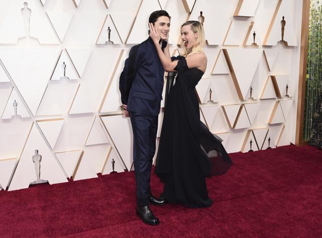 Timothee Chalamet, left, and Margot Robbie arrive at the Oscars on Sunday. (Jordan Strauss/Invision/AP) Timothee Chalamet, left, and Margot Robbie arrive at the Oscars on Sunday. (Jordan Strauss/Invision/AP)