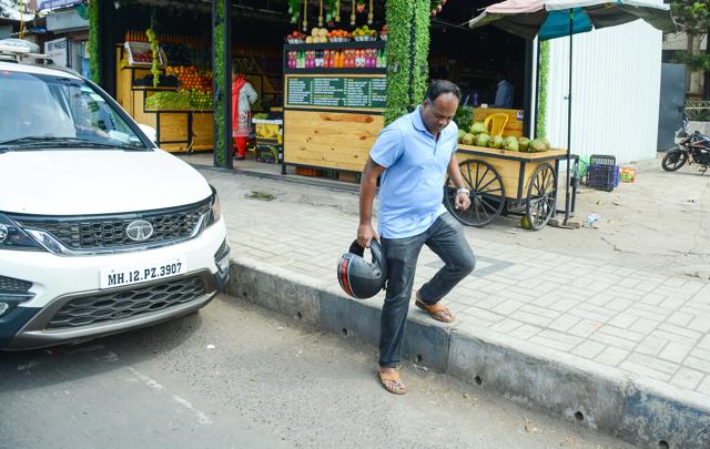 According to the residents who measured the footpath said it was in between 11 to 15 inches (279.4 mm to 381mm) in some places along the stretch from Balaji chowk to Sai chowk. (Milind Saurkar/HT Photo)