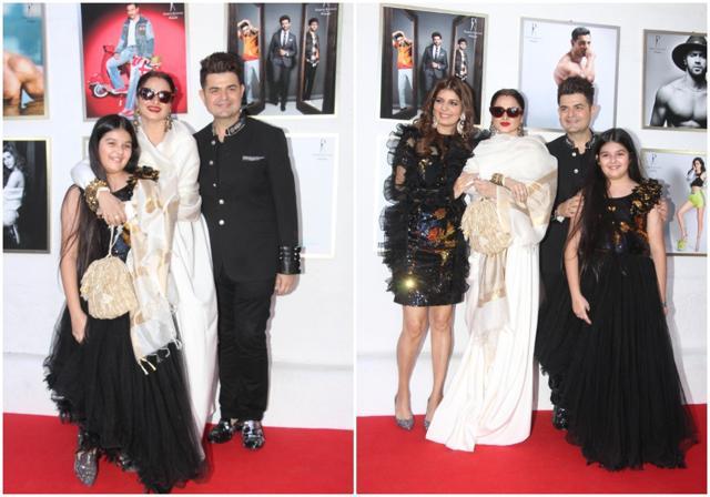 Rekha poses with Dabboo Ratnani and family at the launch. Rekha poses with Dabboo Ratnani and family at the launch.