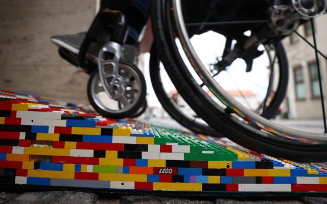 Rita Ebel, nicknamed "Lego grandma", tests one of her wheelchair ramps built from donated Lego bricks. (REUTERS) Rita Ebel, nicknamed "Lego grandma", tests one of her wheelchair ramps built from donated Lego bricks. (REUTERS)