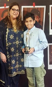 Bhairavi Jaikishan and her son, Arwaan Jai Tara, receive the award on behalf of her late father, Jaikishan.