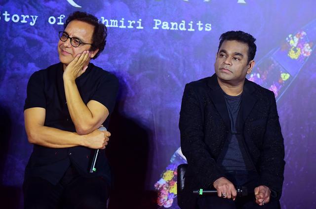 Vidhu Vinod Chopra (L) and film music composer and singer A.R. Rahman (R) pose for photographs during the trailer launch of Shikara in Mumbai. (AFP)