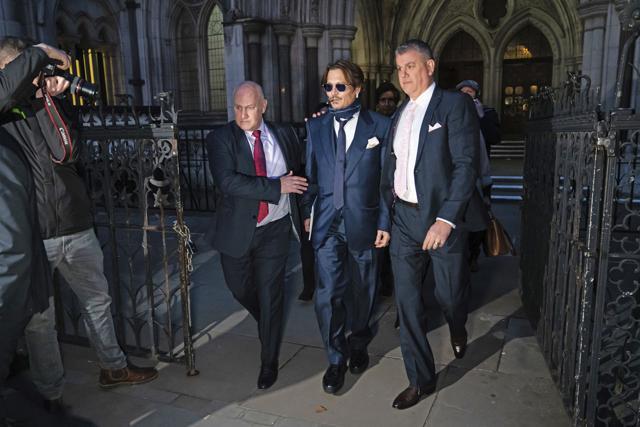 Actor Johnny Depp, center, leaves the High Court in London, after attending a preliminary hearing in his libel case against the publishers of The Sun and its executive editor, Dan Wootton, over a 2018 article alleging he had been abusive to his ex-wife Amber Heard. (AP) Actor Johnny Depp, center, leaves the High Court in London, after attending a preliminary hearing in his libel case against the publishers of The Sun and its executive editor, Dan Wootton, over a 2018 article alleging he had been abusive to his ex-wife Amber Heard. (AP)