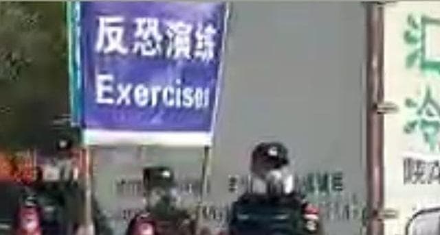 Authorities holding a banner that reads “Exercises.” Authorities holding a banner that reads “Exercises.”