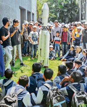 Students across various age groups get a close look at a satellite at IUCAA at the SPPU, on the occasion of Science day on Friday. (Milind Saurkar/HT Photo)
