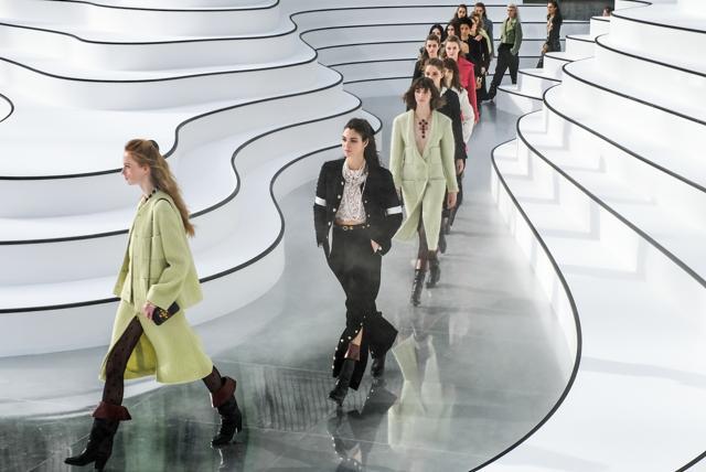 Models saunter down Chanel’s dramatic runway. Models saunter down Chanel’s dramatic runway.