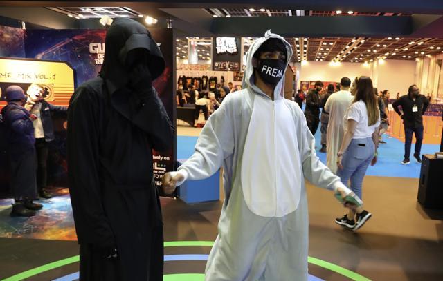 A man dances as he wearing a face mask at the Middle East Comic Con in Dubai, United Arab Emirates, Thursday, March 5, 2020. The Middle East Film &amp; Comic Con has begun in Dubai, a city of skyscrapers and nightclubs suddenly subdued by the outbreak of the new coronavirus across the region. (AP Photo/Kamran Jebreili) (AP)